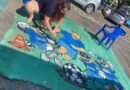 Moradores do Oliveira Camargo se reúnem para pintar rua para a Copa do Mundo